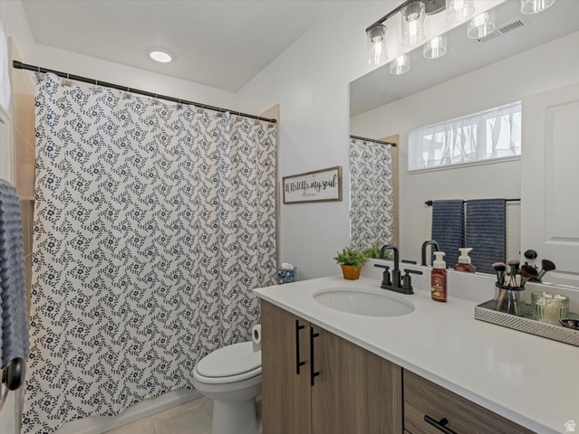 3047 Old Emigrant Road, Unit C Syracuse, UT 84075 - Photo 13 of 20 Full bath featuring vanity, curtained shower, and light tile patterned flooring