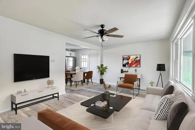 a kitchen with stainless steel appliances granite countertop a refrigerator sink and stove