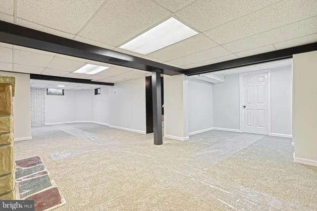 a view of a house with a yard and pathway