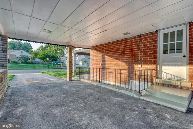 an aerial view of a house with pool big yard and outdoor seating