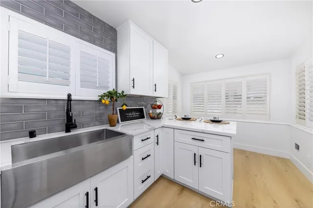 a kitchen with a stove a refrigerator and a table