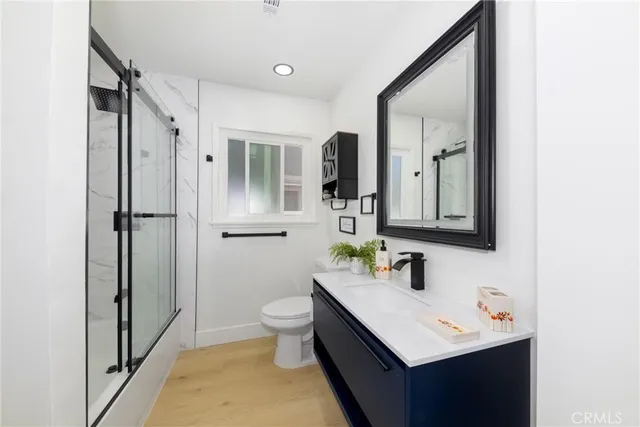 a bathroom with a glass shower door