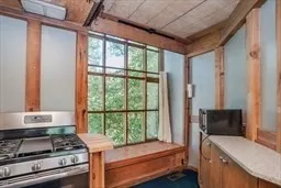 a bedroom with furniture and a window