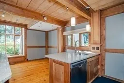 a kitchen with stainless steel appliances granite countertop a sink and a refrigerator