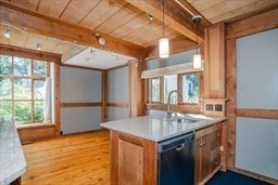 53 Pine Grove, Unit 53 Amherst, MA 01002 - Photo 16 of 34 a kitchen with stainless steel appliances granite countertop a sink and a refrigerator