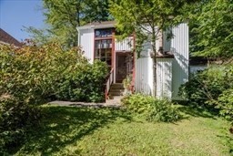 53 Pine Grove, Unit 53 Amherst, MA 01002 - Photo 2 of 34 a couple of flower plants in front of house