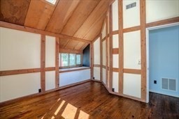 53 Pine Grove, Unit 53 Amherst, MA 01002 - Photo 26 of 34 a view of an empty room with wooden floor and a window