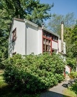 53 Pine Grove, Unit 53 Amherst, MA 01002 - Photo 3 of 34 a view of a house with a yard and plants