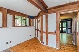 53 Pine Grove, Unit 53 Amherst, MA 01002 - Photo 31 of 34 a view of a hallway with a window and wooden floor