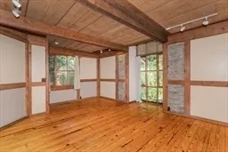 a bedroom with a large bed and a large window