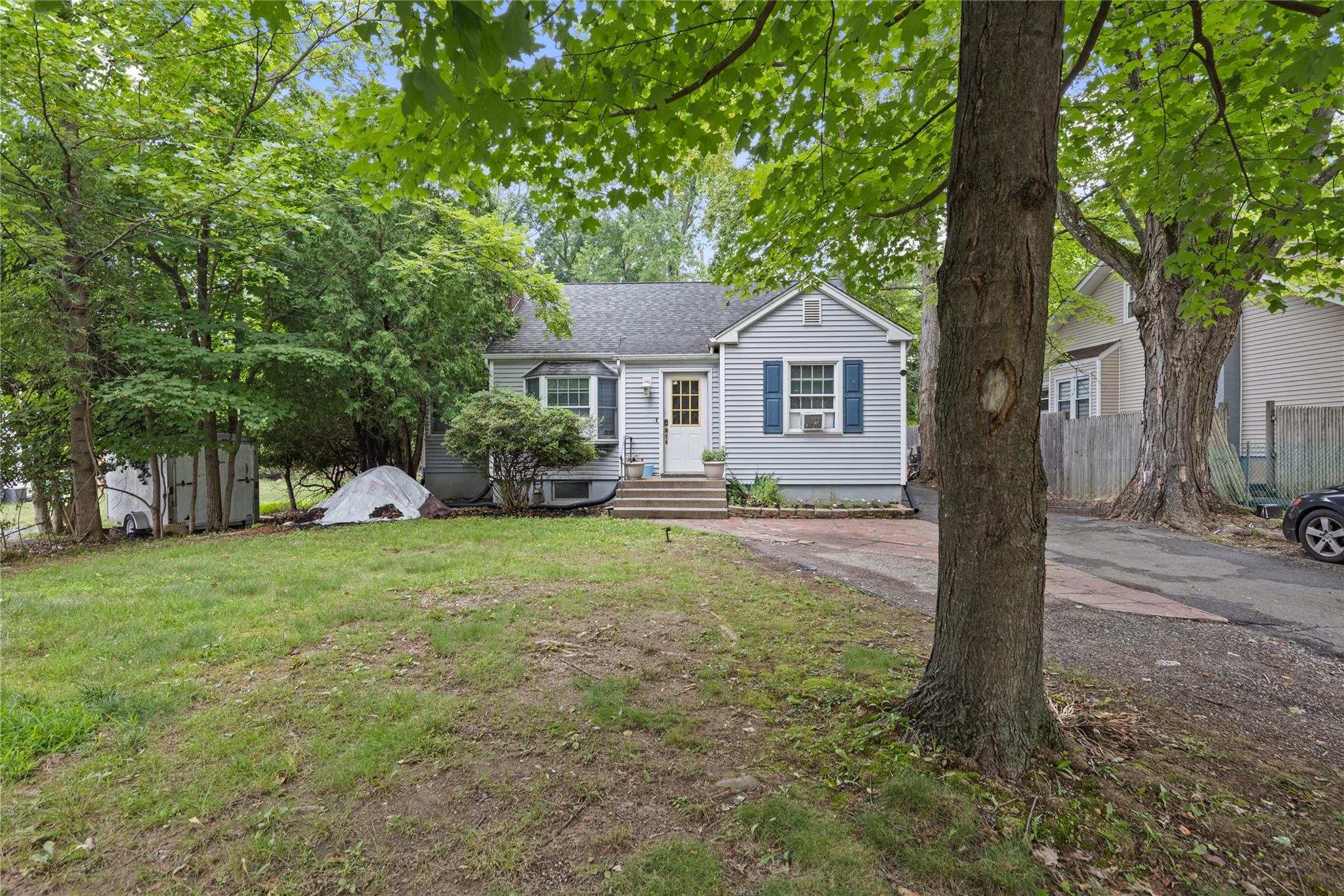 View of front of house featuring roof with shingles