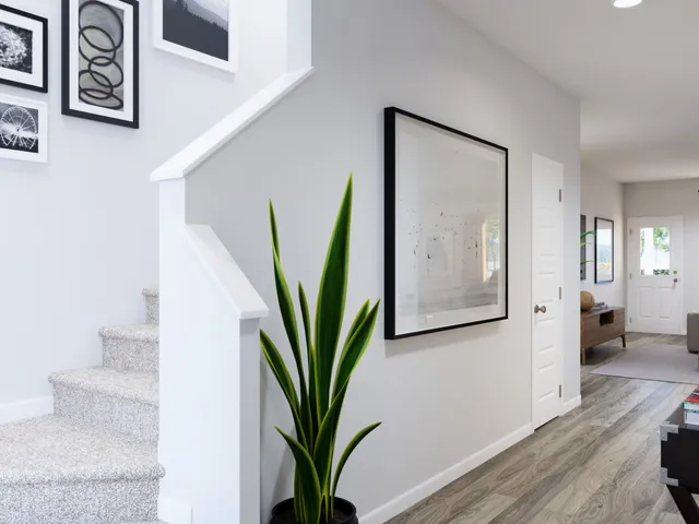 a kitchen with stainless steel appliances kitchen island granite countertop a dining table chairs and refrigerator