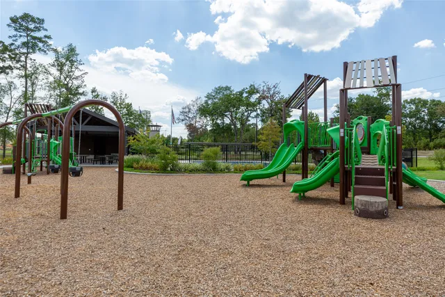 a living room with furniture kitchen view and a potted plant