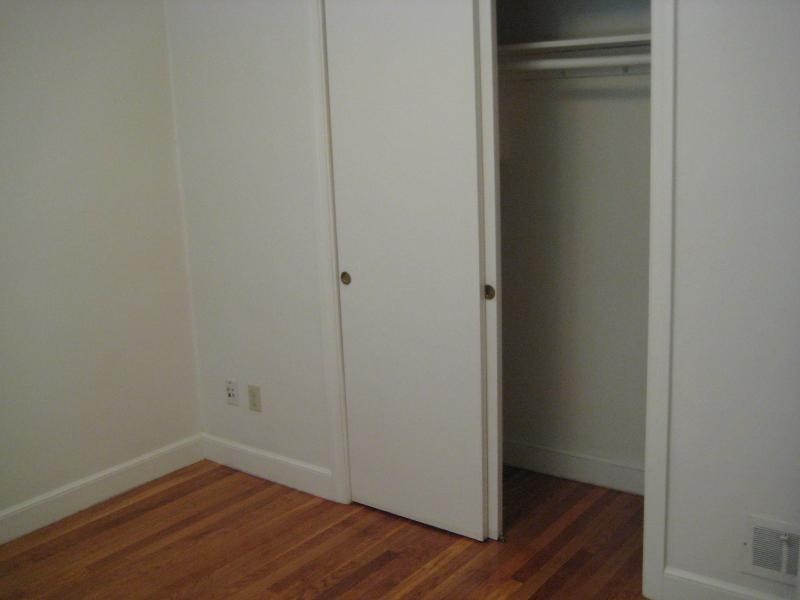 37 Linden Street, Unit 23 Wellesley, MA 02482 - Photo 6 of 9 a view of a small space with wooden floor and closet