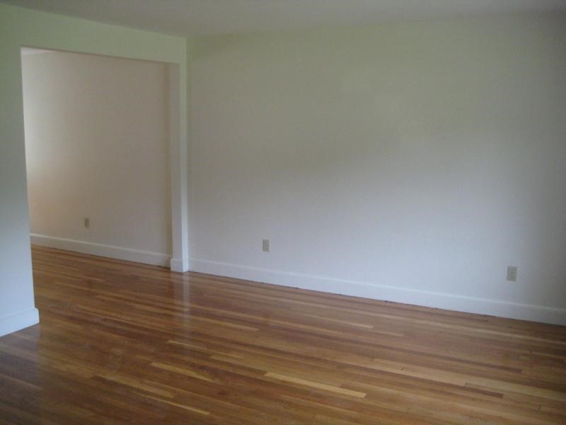37 Linden Street, Unit 23 Wellesley, MA 02482 - Photo 9 of 9 a view of an empty room with wooden floor