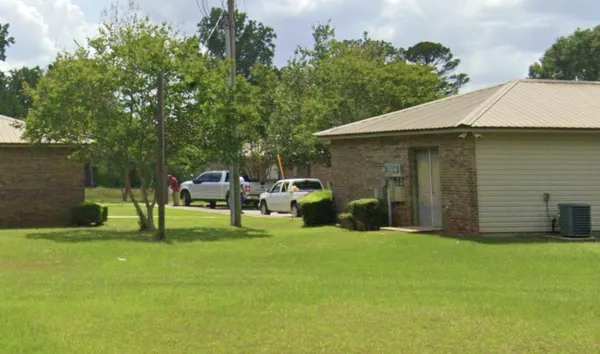 a view of a patio with table and chairs and potted plants