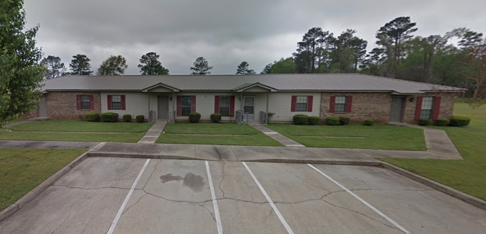 22271 Hwy 69 Other Al Other, AL 36524 - Photo 6 of 7 a view of a white house next to a yard with big trees