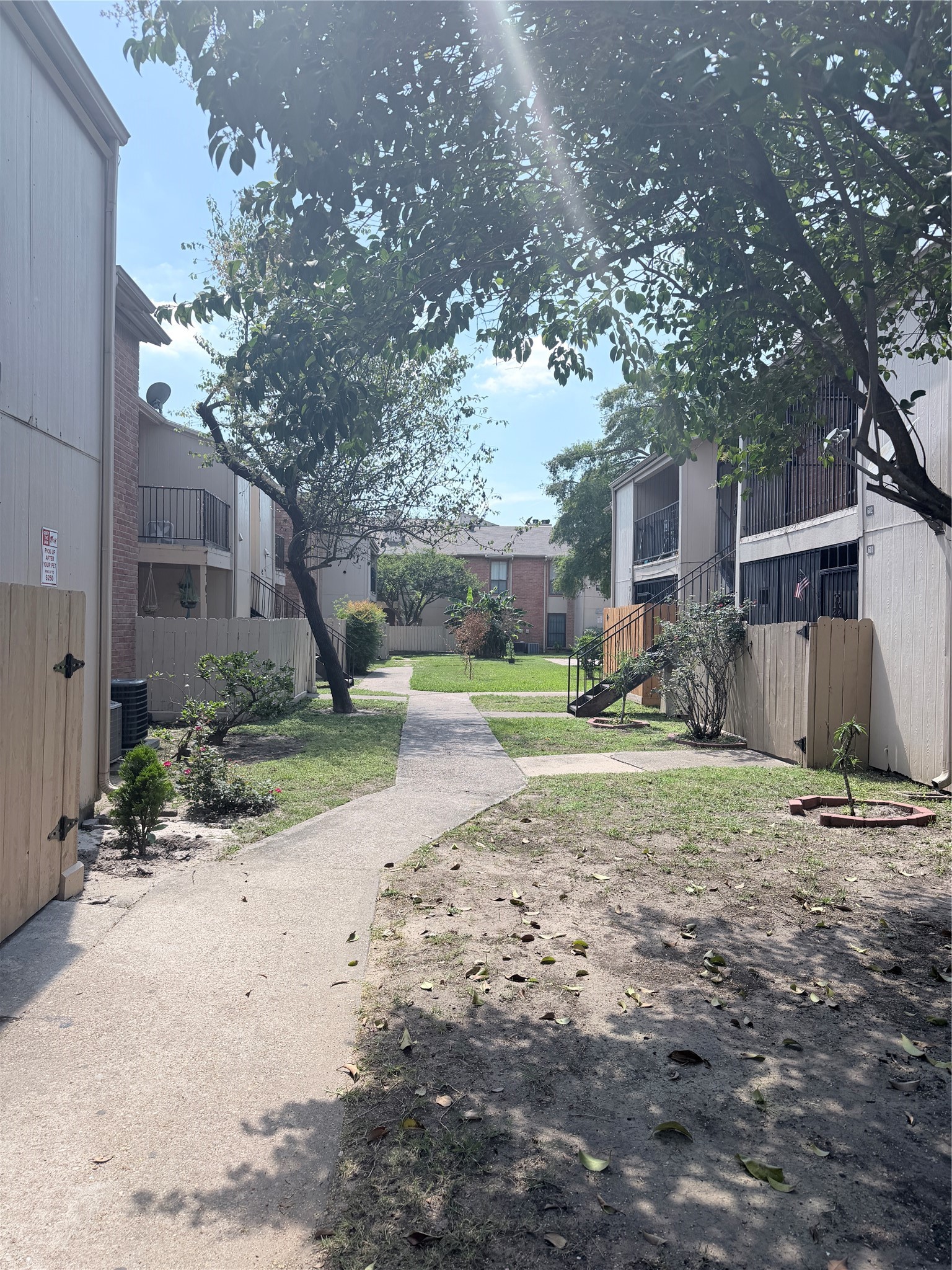 10100 South Gessner Road, Unit 606 Houston, TX 77071 - Photo 11 of 12 a view of a yard with plants and a large tree
