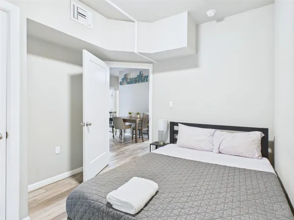 a bedroom with a bed and a couch