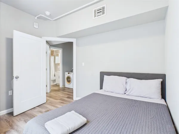 a view of room with wooden floor