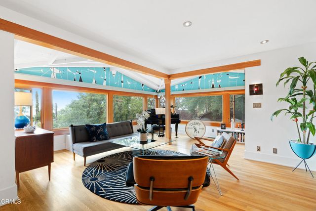 a view of a dining room with furniture window and outside view