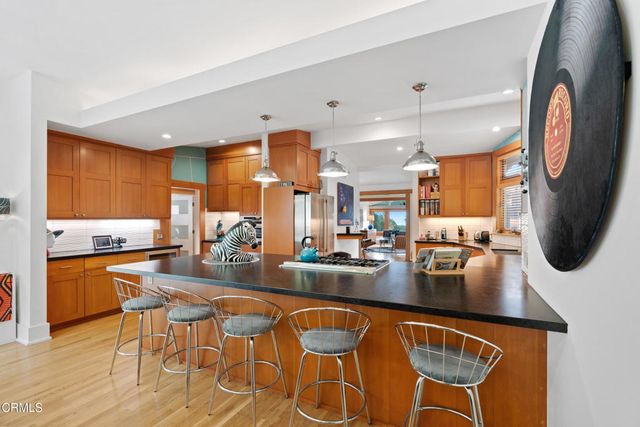 a kitchen with a refrigerator and a sink