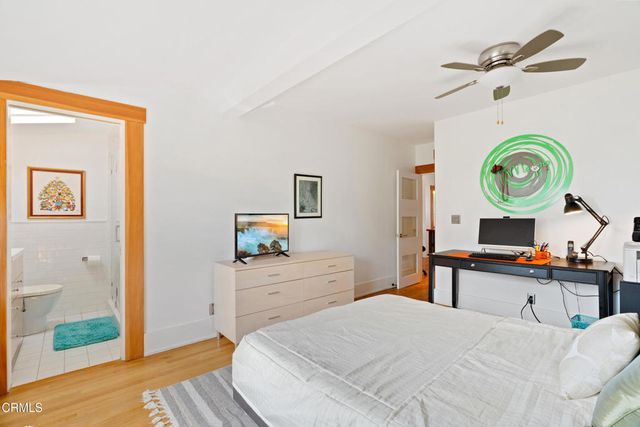 a view of backyard of house with seating space