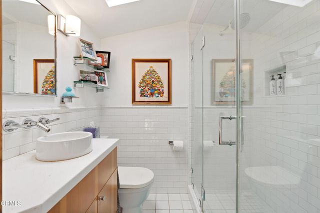 an aerial view of house with yard and swimming pool