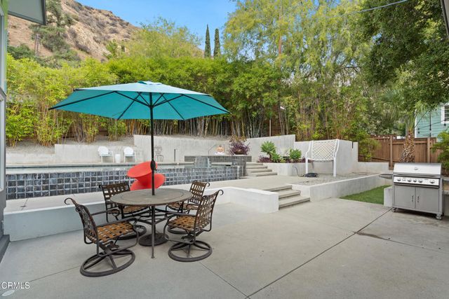 an aerial view of house with yard