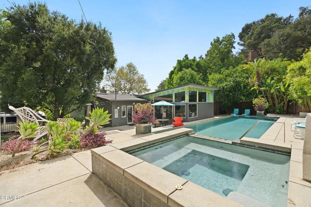a view of a park with large trees