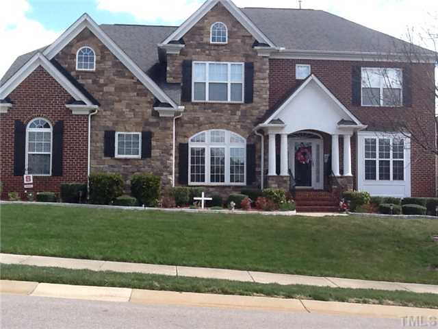 1609 Stannard Trail Raleigh, NC 27612 - Photo 1 of 25 a front view of a house with a yard