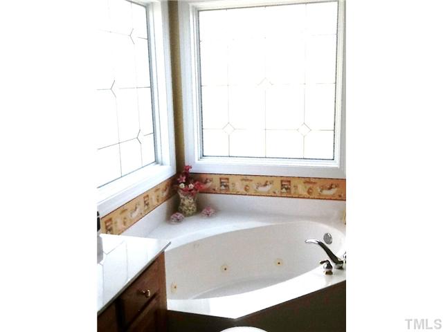 1609 Stannard Trail Raleigh, NC 27612 - Photo 11 of 25 a bathroom with a sink and a bathtub