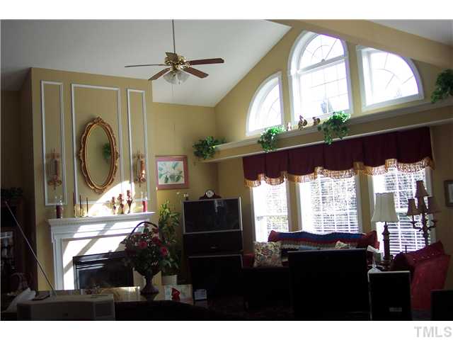 1609 Stannard Trail Raleigh, NC 27612 - Photo 12 of 25 a living room with furniture and a large window