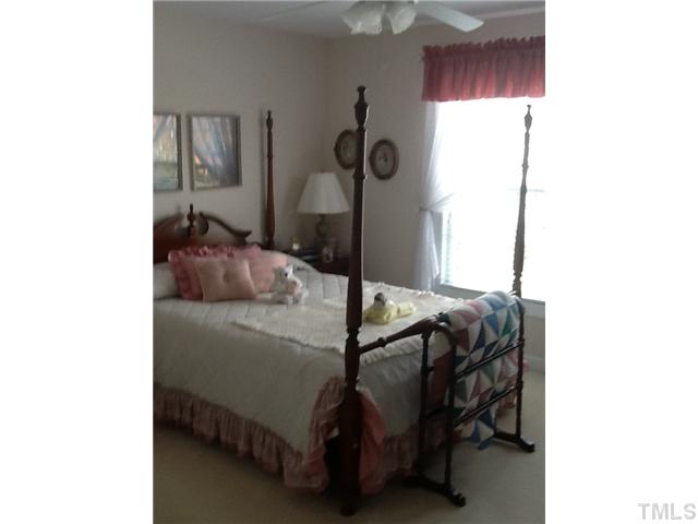 1609 Stannard Trail Raleigh, NC 27612 - Photo 14 of 25 a bedroom with a bed and a window