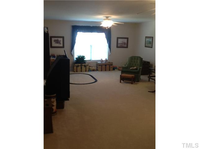 1609 Stannard Trail Raleigh, NC 27612 - Photo 18 of 25 a living room with furniture and a window