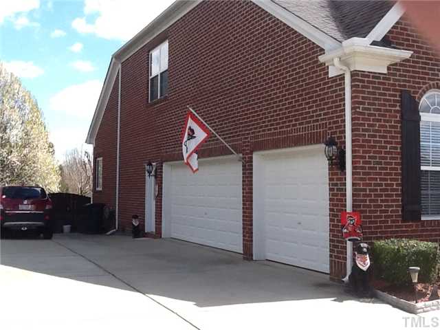 1609 Stannard Trail Raleigh, NC 27612 - Photo 20 of 25 a front view of a house with a garage