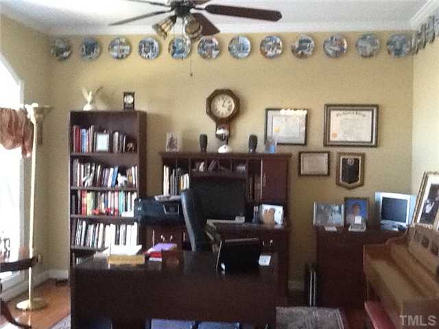 1609 Stannard Trail Raleigh, NC 27612 - Photo 6 of 25 a living room with furniture and painting on the wall