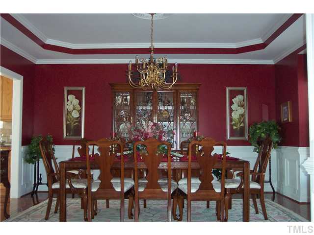 1609 Stannard Trail Raleigh, NC 27612 - Photo 7 of 25 a view of a dining room with furniture and chandelier