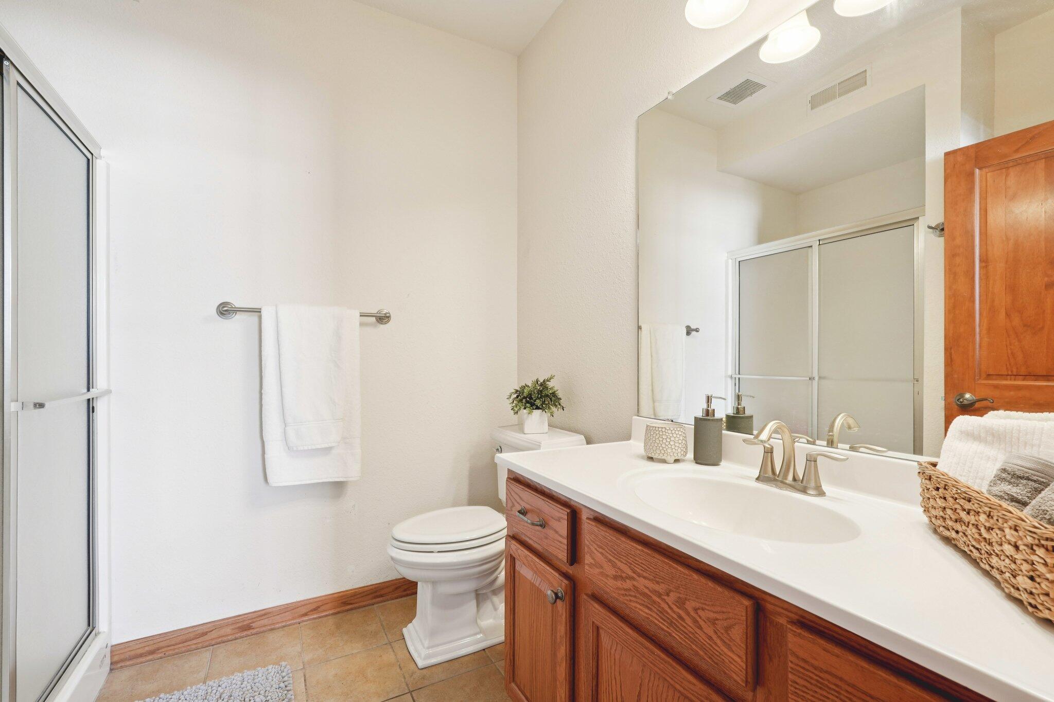 1620 Grey Fox Trail, Unit D Mukwonago, WI 53149 - Photo 17 of 35 Large Vanity, shower stall, tiled floor, Linen closet.