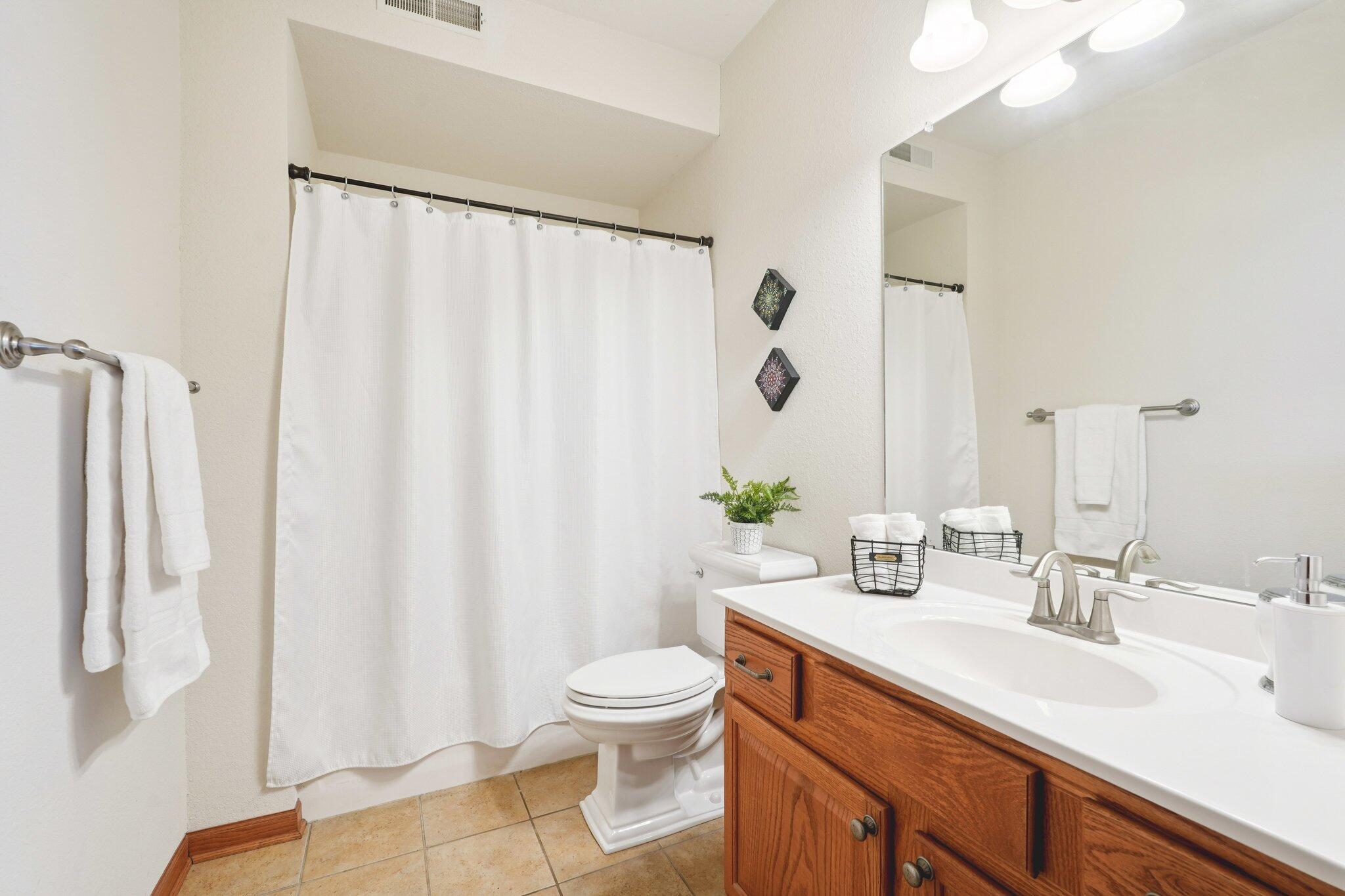1620 Grey Fox Trail, Unit D Mukwonago, WI 53149 - Photo 20 of 35 Shower over tub, large vanity with integrated sink, linen closet.