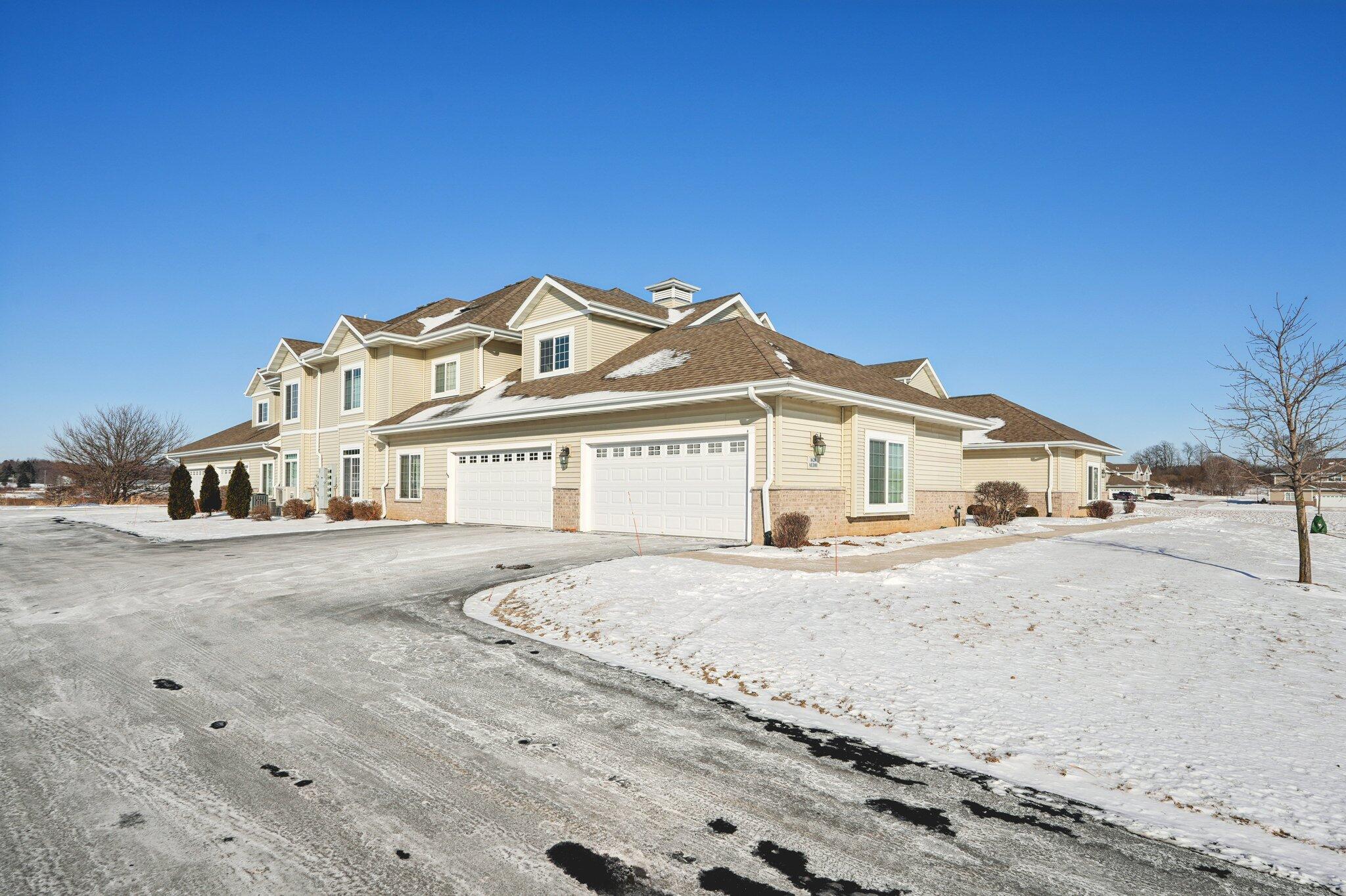 1620 Grey Fox Trail, Unit D Mukwonago, WI 53149 - Photo 25 of 35 Garage overhead door has a full screen unit...another outdoor space!