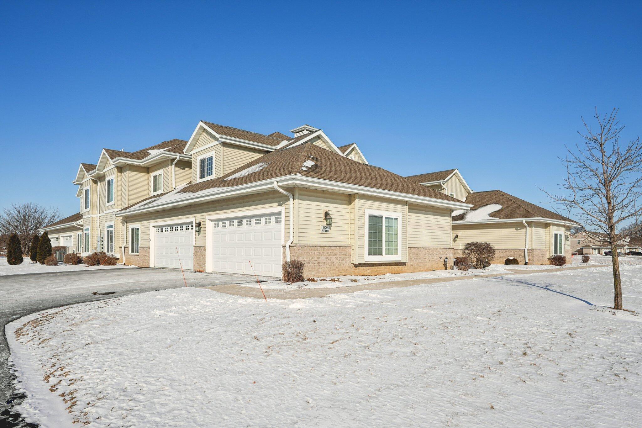 1620 Grey Fox Trail, Unit D Mukwonago, WI 53149 - Photo 32 of 35 Hanging shelving & garage door opener.