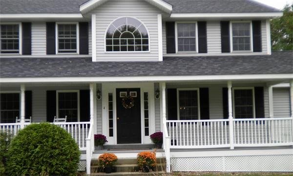 4 Fern Street Templeton, MA 01436 - Photo 30 of 30 front view of a brick house with large windows