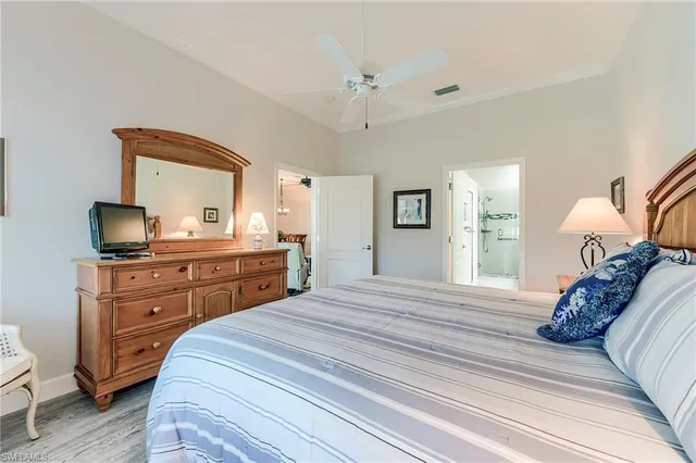 a bedroom with a bed and a dresser