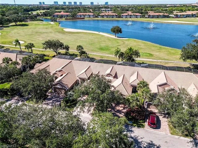 an aerial view of a residential building and lake view