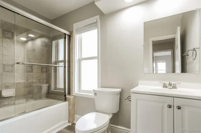 an empty room with wooden floor