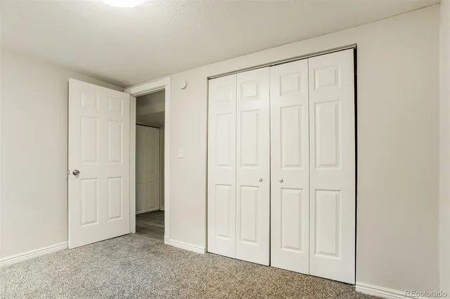a bathroom with a sink toilet and a mirror
