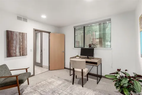 a workspace with furniture and a window