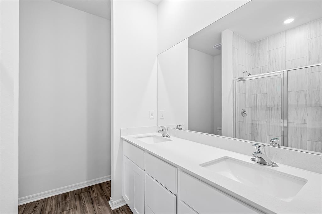 7886 99th Court Vero Beach, FL 32967 - Photo 12 of 18 a bathroom with a sink and a mirror