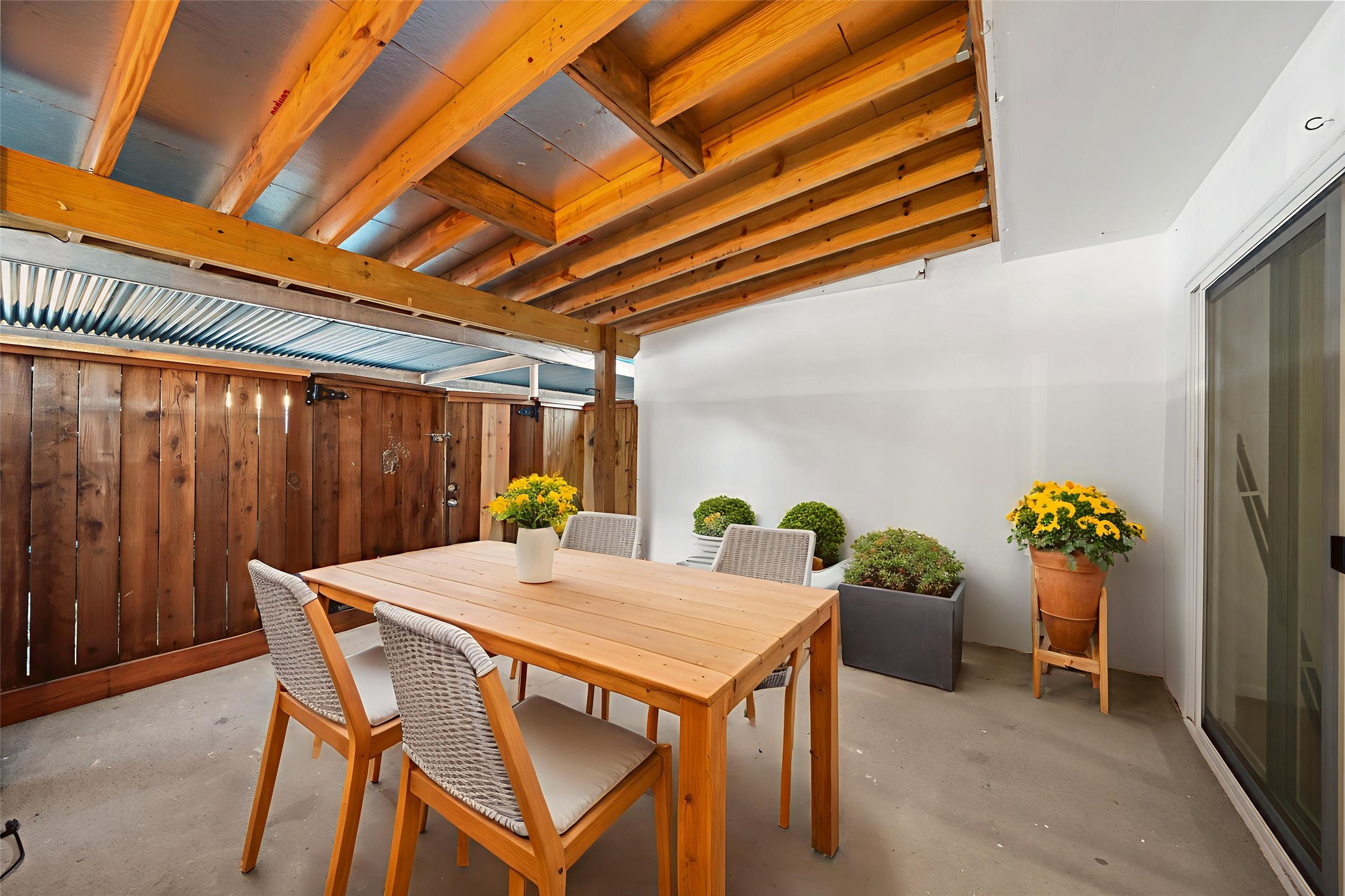 9654 Westview Drive, Unit 9 Houston, TX 77055 - Photo 32 of 47 Covered outdoor patio accessible from back Den - virtually staged